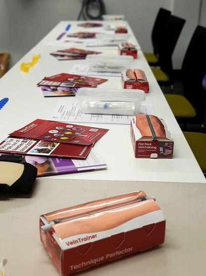 Table with medical training VeinTrain flat-pack vein simulator for phlebotomy and cannulation training

